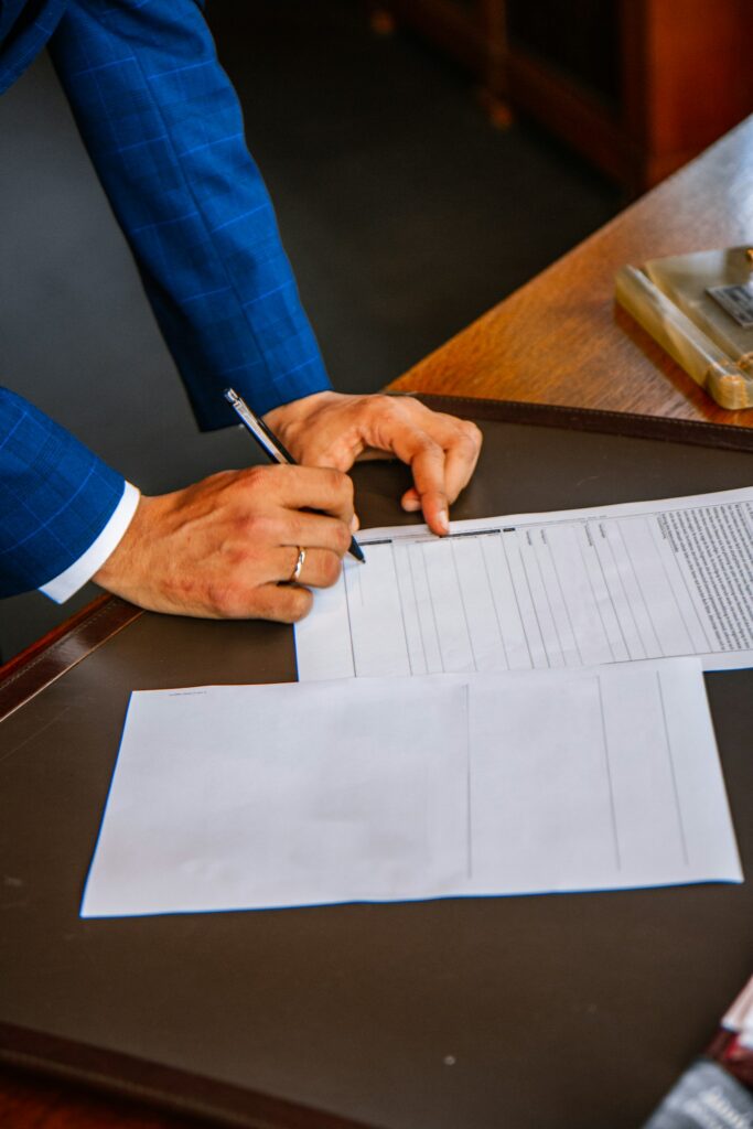 Person filling out a paper form